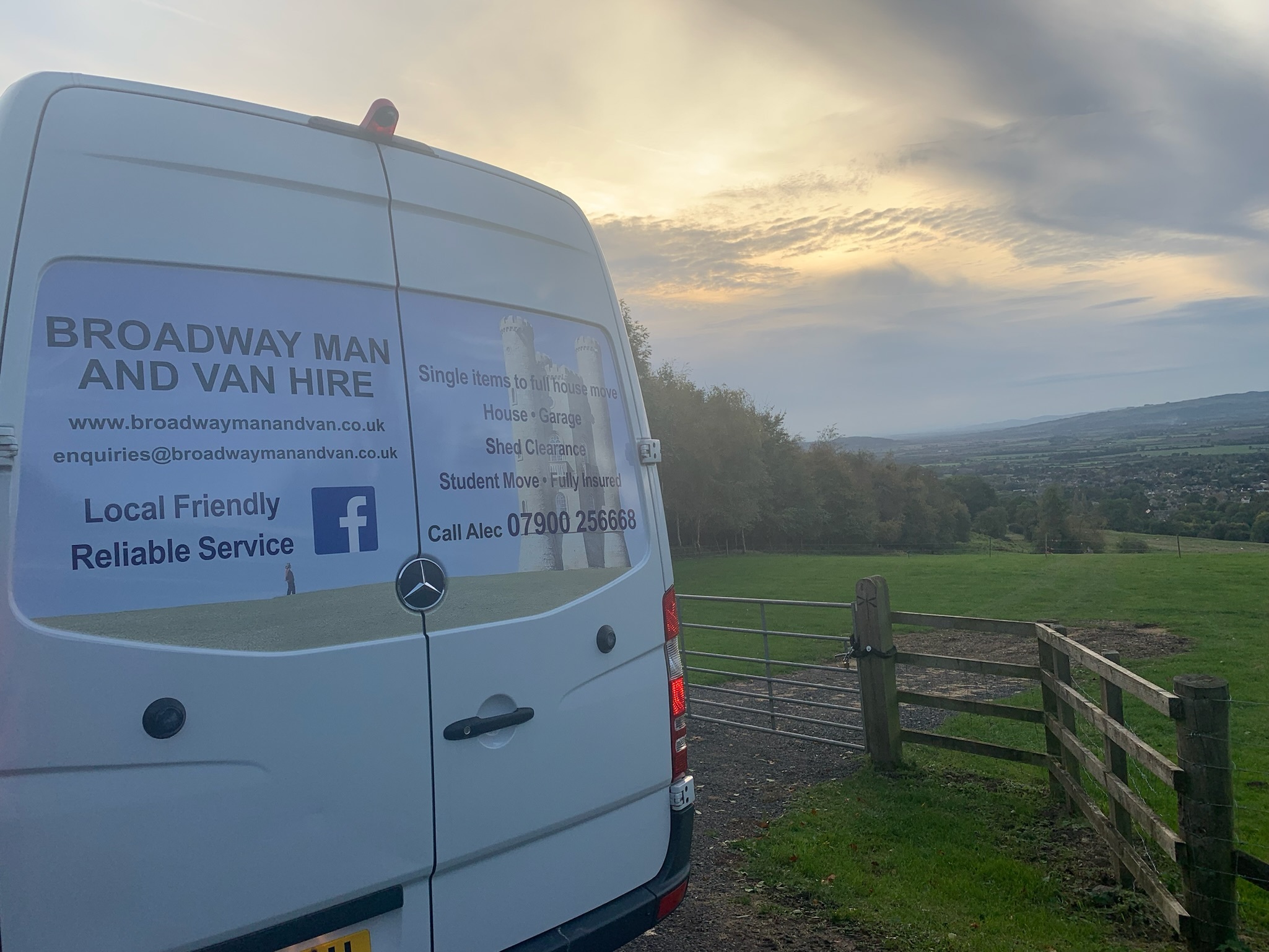 rear doors of the big white van at sunset