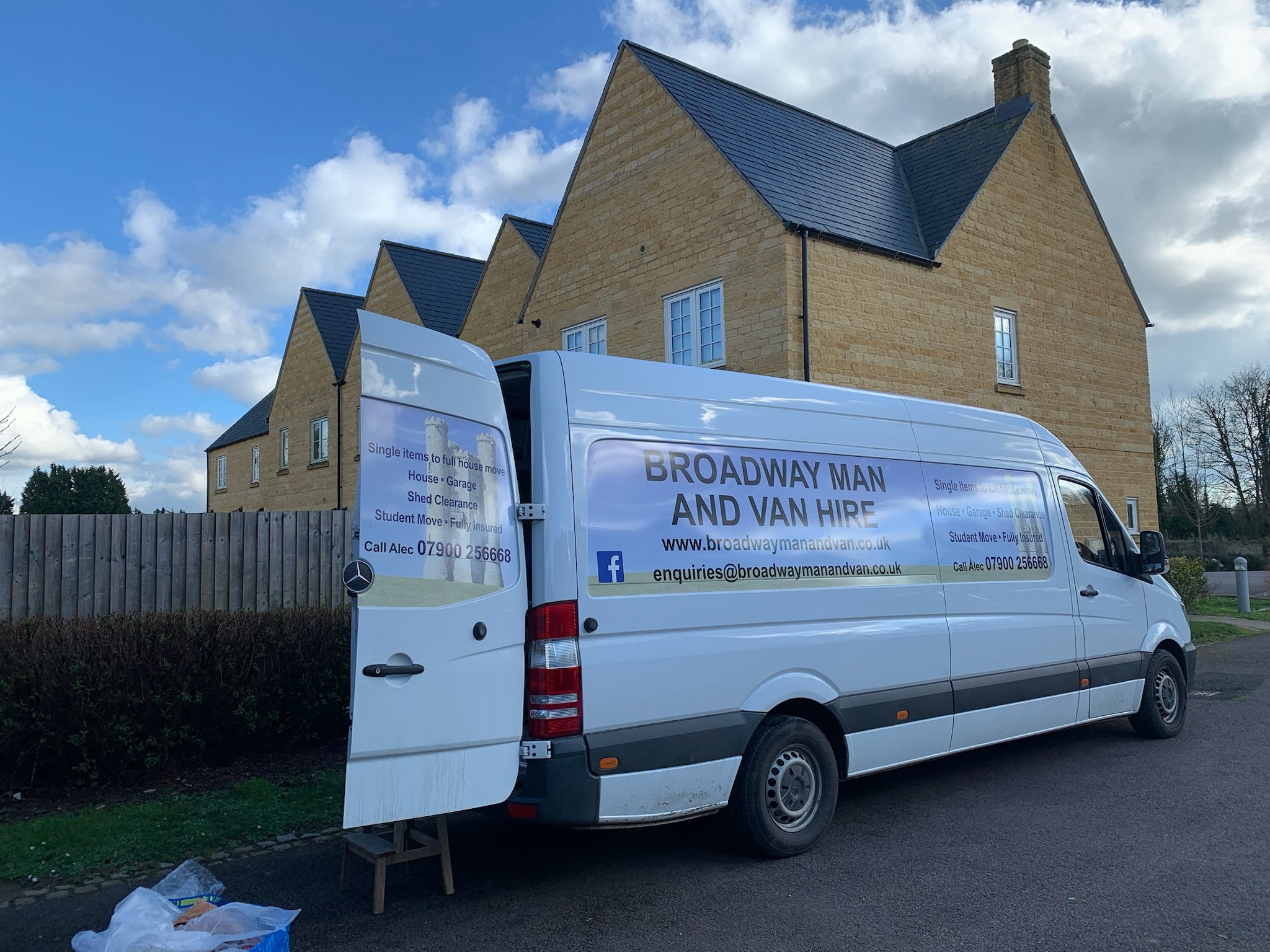 big white van with rear doors open